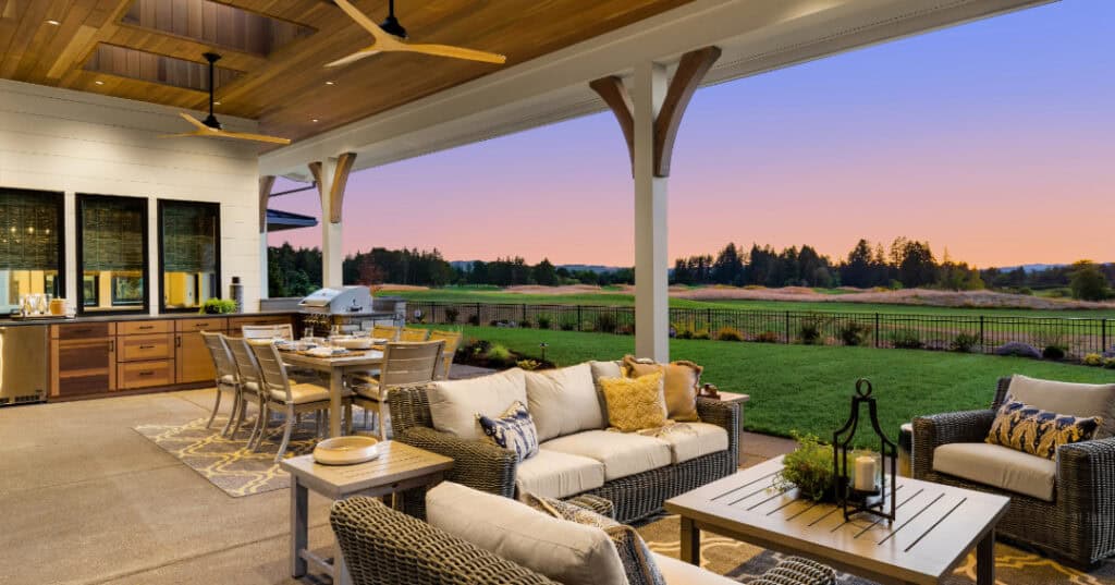 Country style outdoor kitchen and lounge area at sunset.