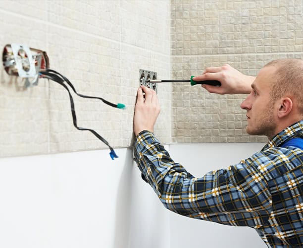 Electrician Installing Power Outlet Screwdriver